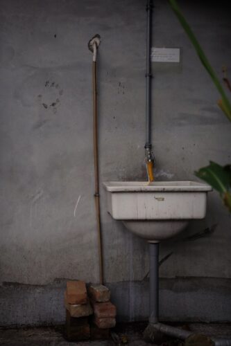 white ceramic sink with faucet